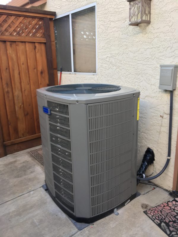 newly installed residential AC unit behind house in ceres ca