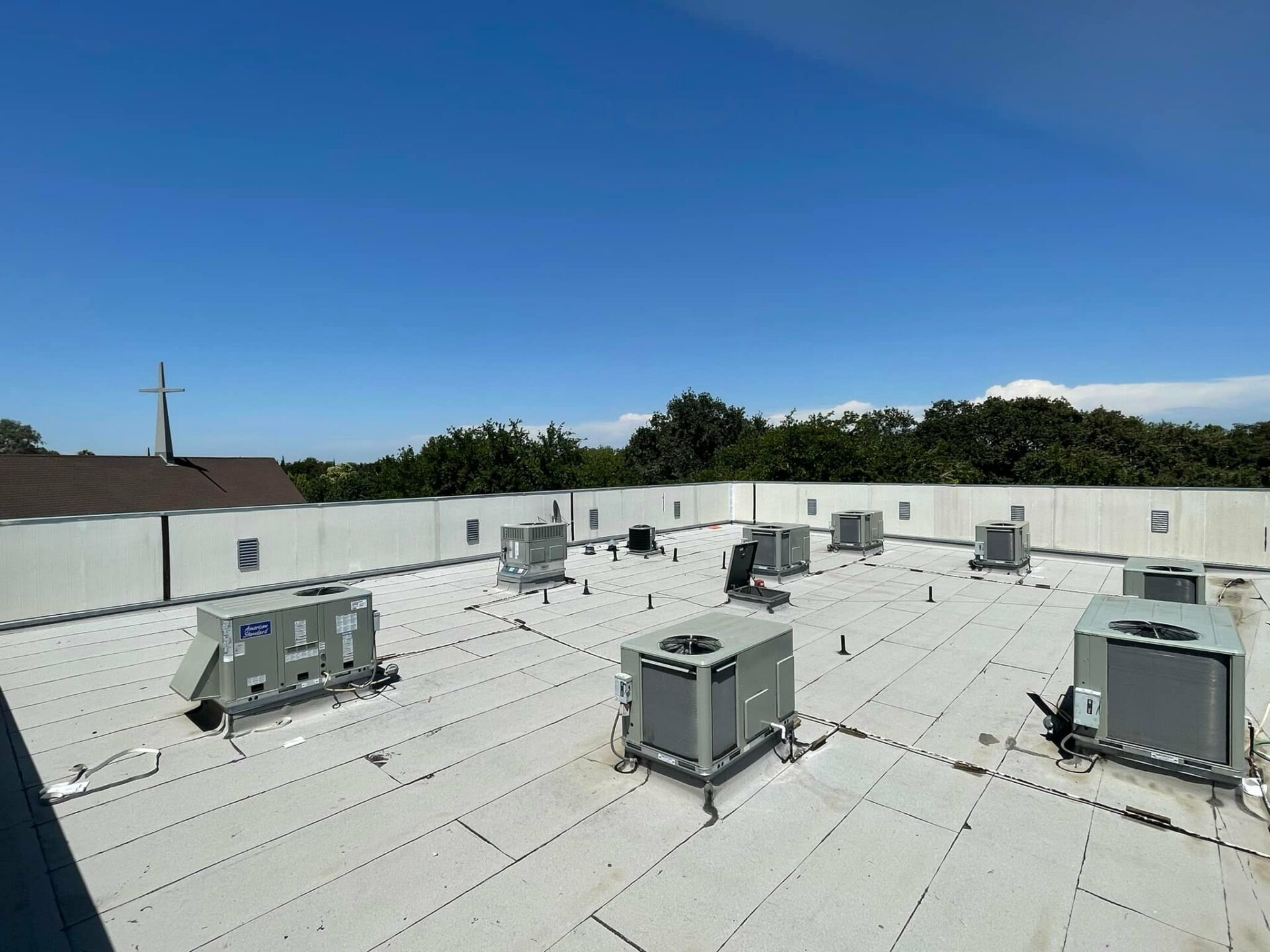 array of smaller rooftop air conditioners for a retail property